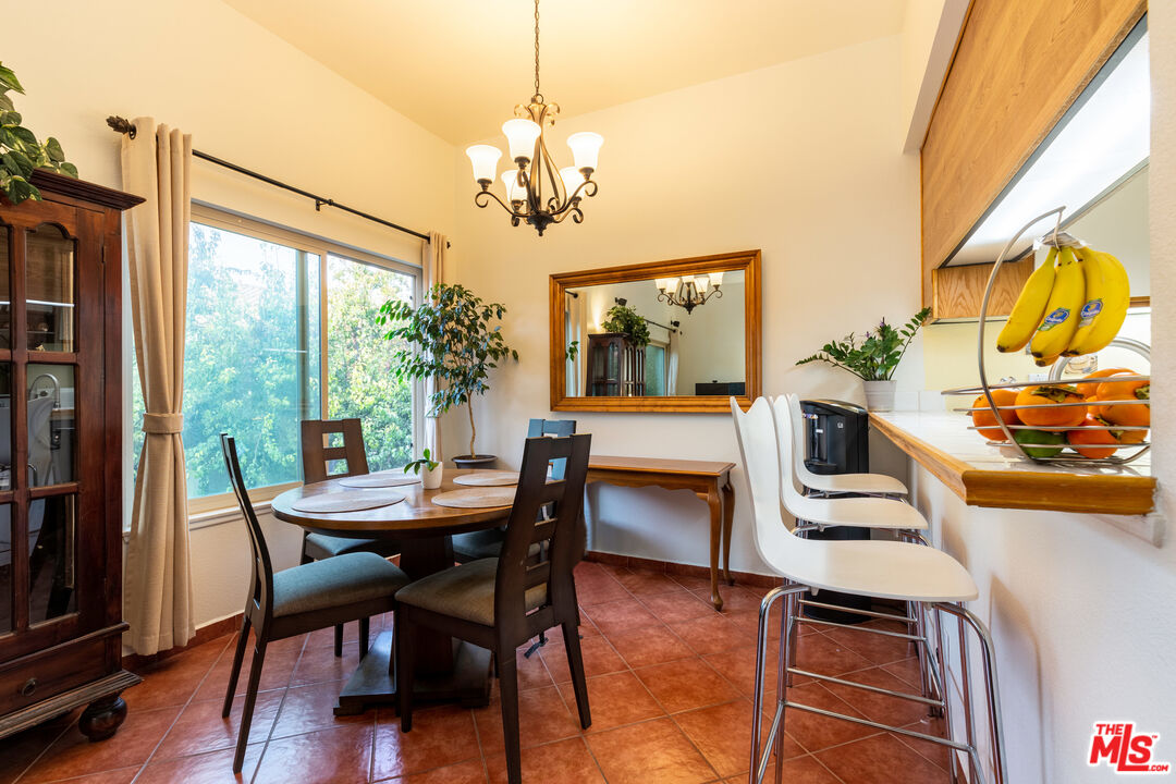 1754 Sinaloa Road, Unit 274 Simi Valley, CA 93065 - Photo 5 of 23 a view of a dining room with furniture a chandelier and wooden floor