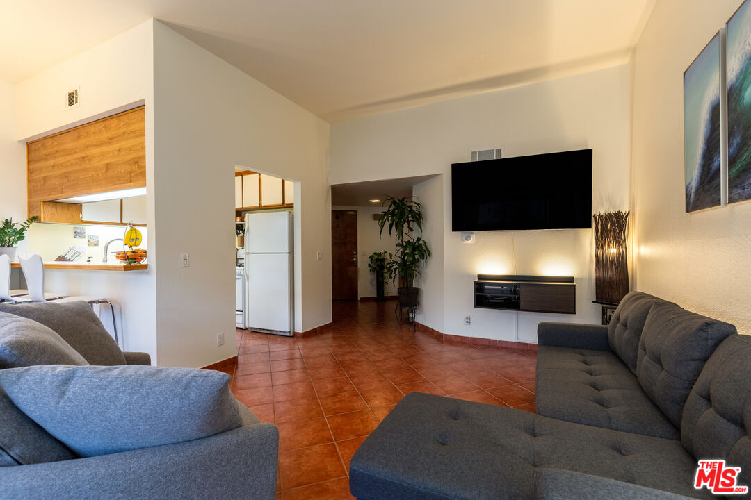 1754 Sinaloa Road, Unit 274 Simi Valley, CA 93065 - Photo 7 of 23 a living room with furniture and a flat screen tv