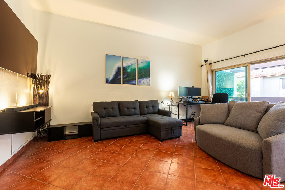 1754 Sinaloa Road, Unit 274 Simi Valley, CA 93065 - Photo 8 of 23 a living room with furniture and a flat screen tv