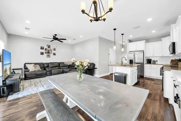 a kitchen with sink and refrigerator