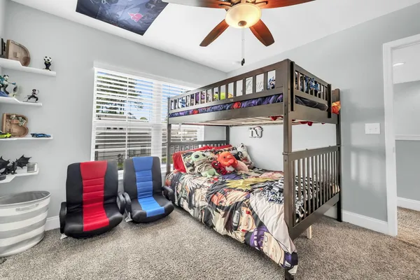a bedroom with furniture and a chandelier