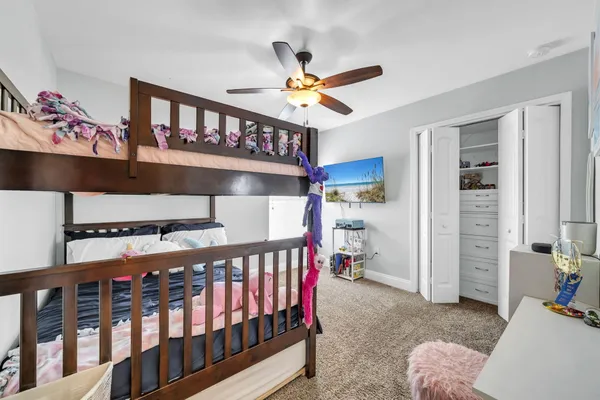 a view of a livingroom with furniture and closet