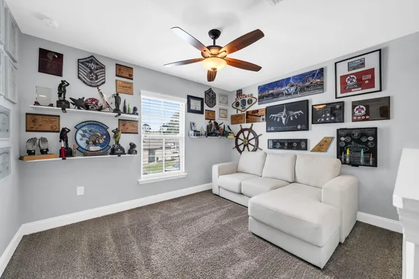 a living room with furniture and a window