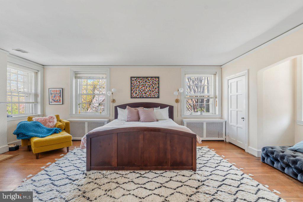 2 East Highfield Road Baltimore, MD 21218 - Photo 22 of 46 a bedroom with a bed and a window