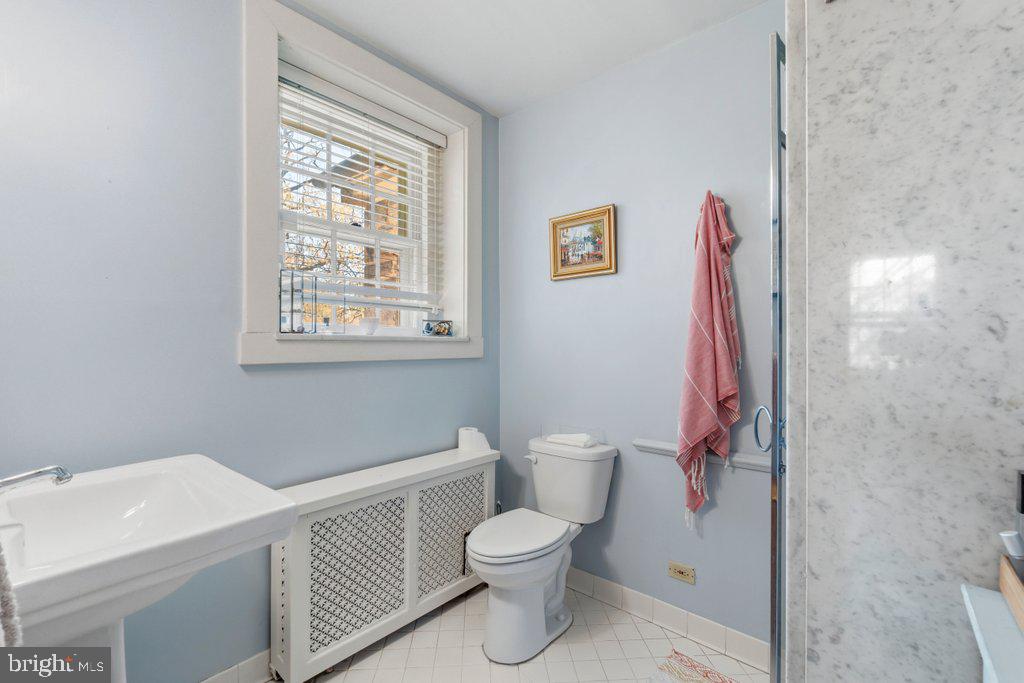2 East Highfield Road Baltimore, MD 21218 - Photo 25 of 46 a bathroom with a toilet and a shower