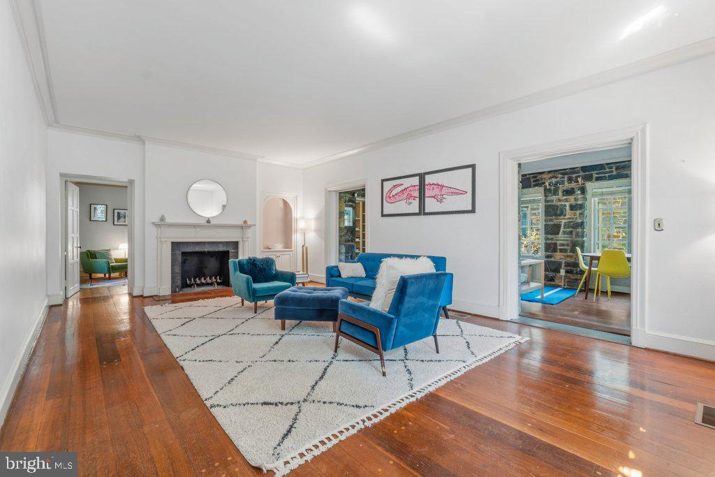 2 East Highfield Road Baltimore, MD 21218 - Photo 6 of 46 a living room with furniture and a fireplace