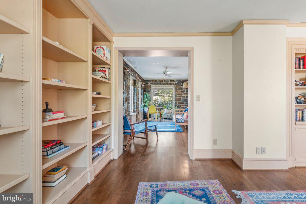 2 East Highfield Road Baltimore, MD 21218 - Photo 10 of 46 a living room with furniture and a book shelf