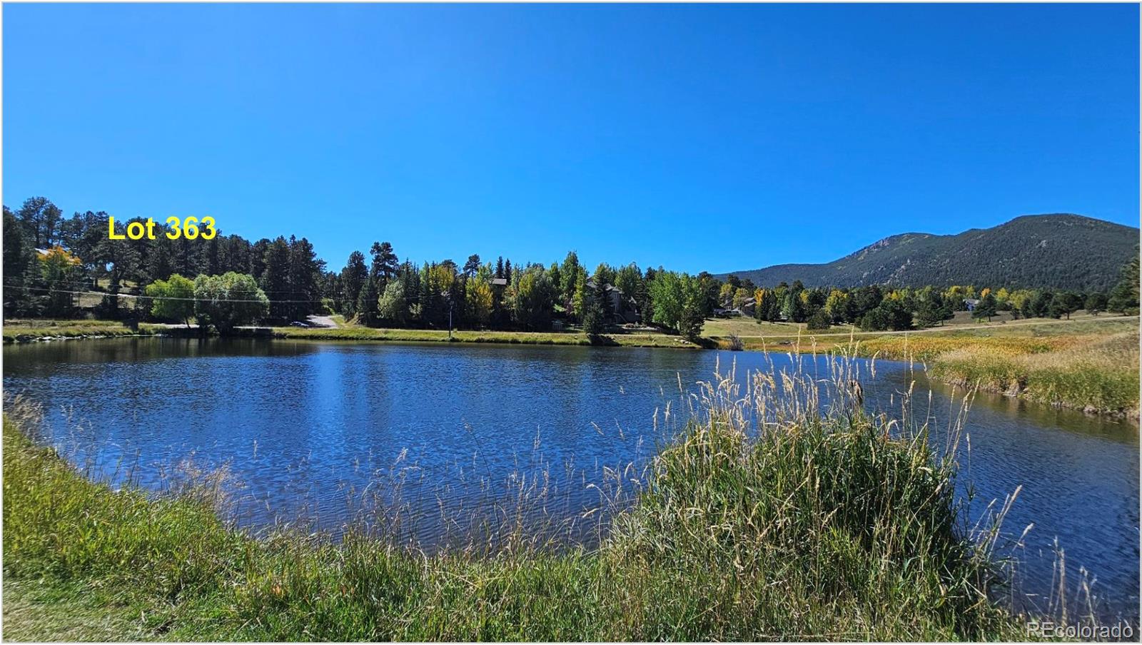 Lot 363 Interlocken Court Evergreen, CO 80439 - Photo 12 of 14 a view of lake with a house in the background