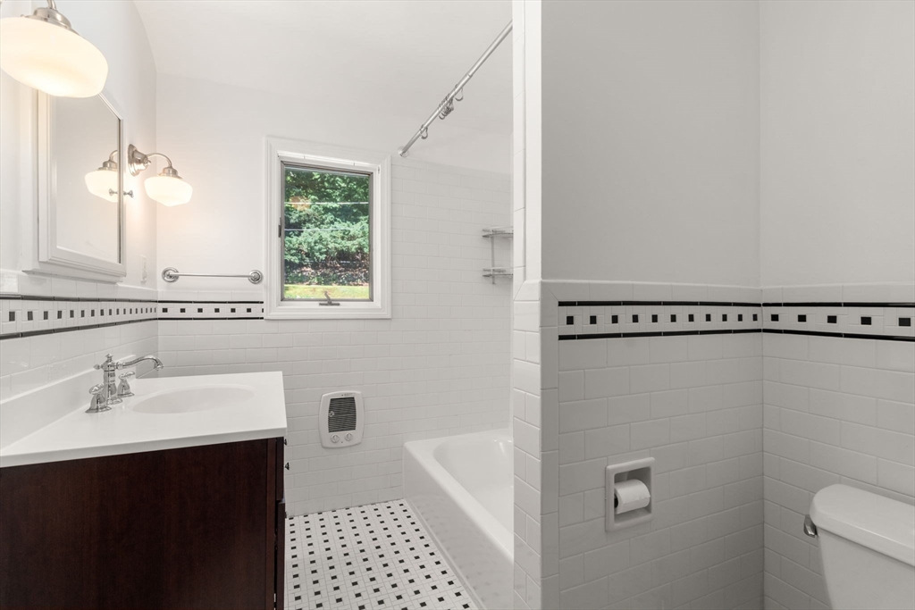 43 Laconia Road Worcester, MA 01609 - Photo 18 of 37 a bathroom with a sink a toilet and shower