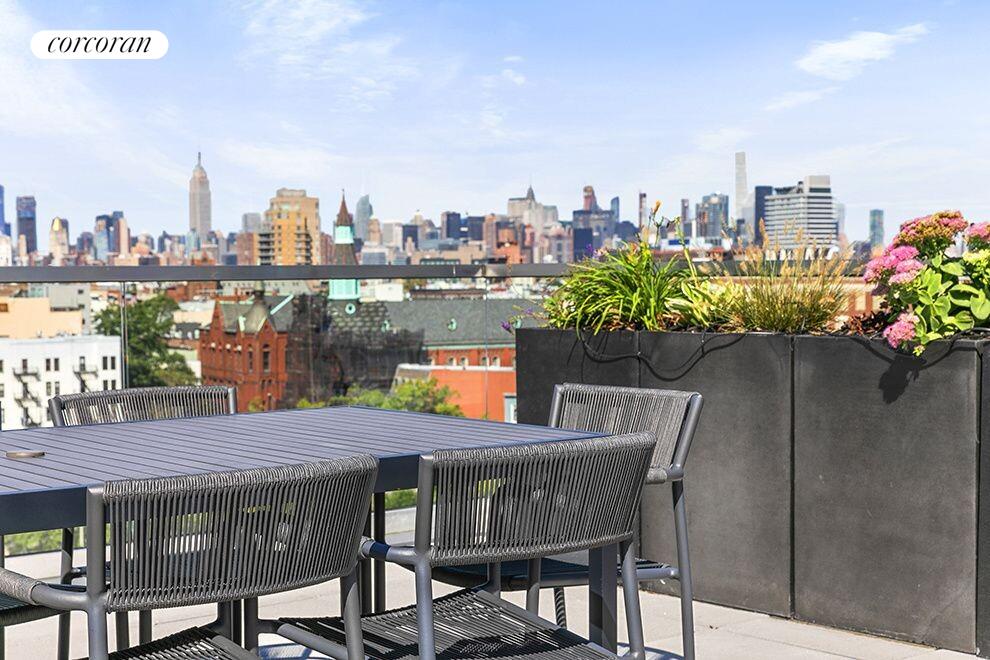 123 Hope Street, Unit 4C Brooklyn, NY 11211 - Photo 11 of 13 a view of a chairs and table in the terrace