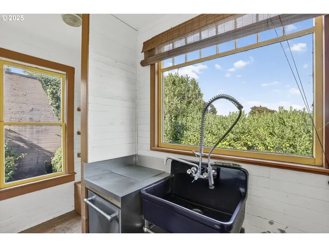 a view of a living room and a floor to ceiling window