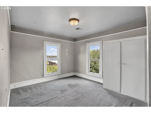 a view of an empty room with a window