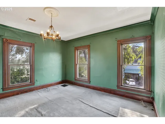 a view of livingroom with window and hardwood floor