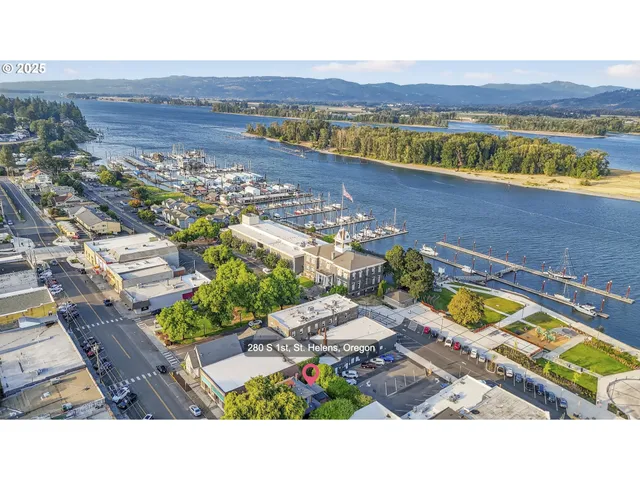 a view of a house with a tree beside it