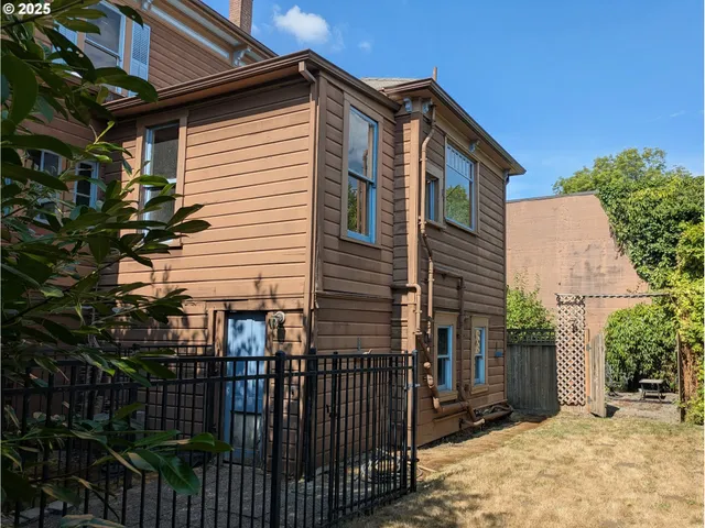 a picture of a room with a cabinet and a refrigerator