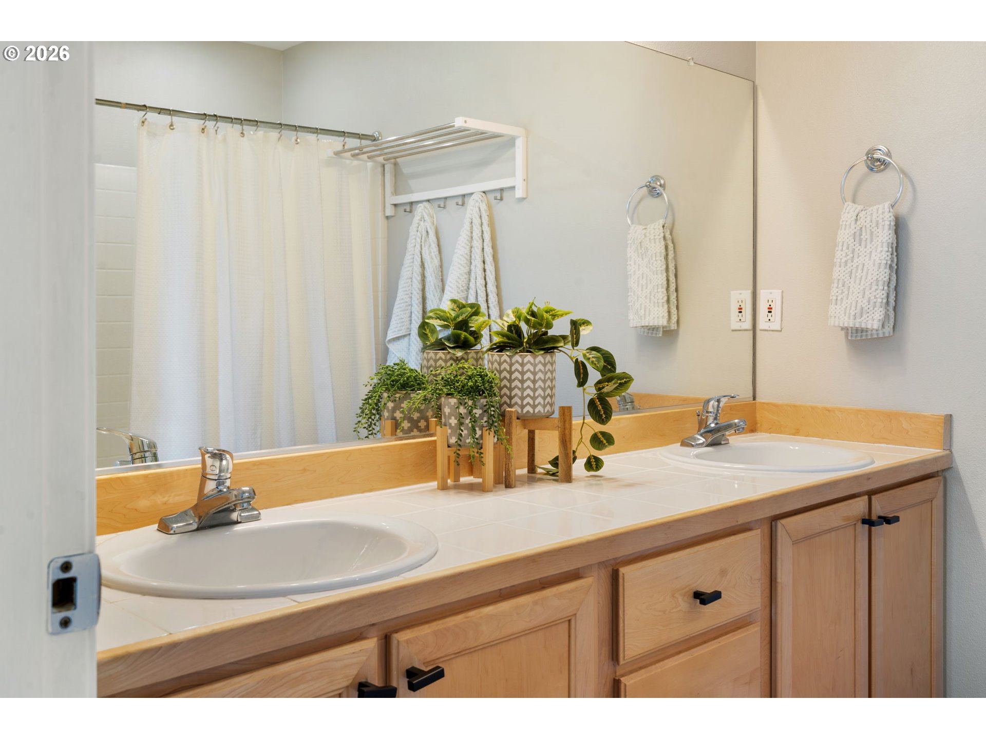 13159 Southwest Brianne Way Portland, OR 97223 - Photo 17 of 32 a bathroom with a sink and a mirror