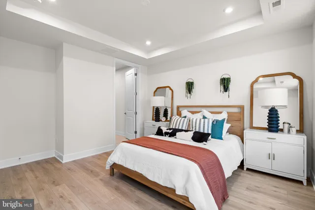 a bed room with a bed and a mirror