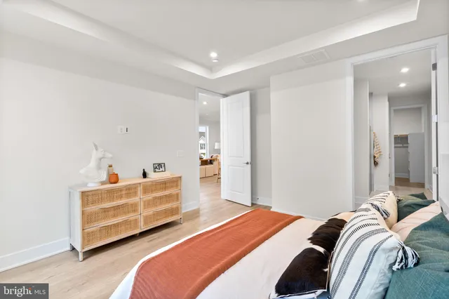 a bedroom with a bed and a couch