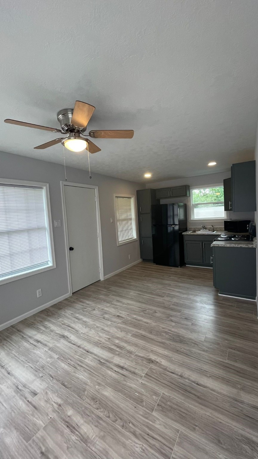 1723 Alta Vista Street, Unit A Houston, TX 77023 - Photo 2 of 7 a view of a kitchen with a sink and a stove top oven