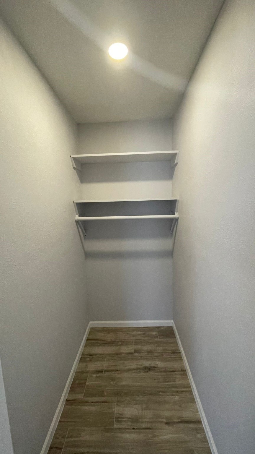 1723 Alta Vista Street, Unit A Houston, TX 77023 - Photo 6 of 7 a view of a room with empty racks