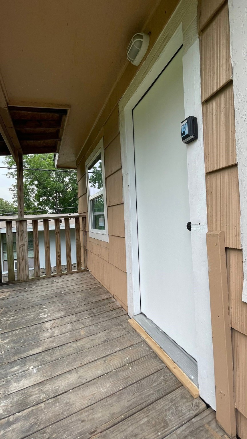 1723 Alta Vista Street, Unit A Houston, TX 77023 - Photo 7 of 7 an empty room with wooden floor and windows