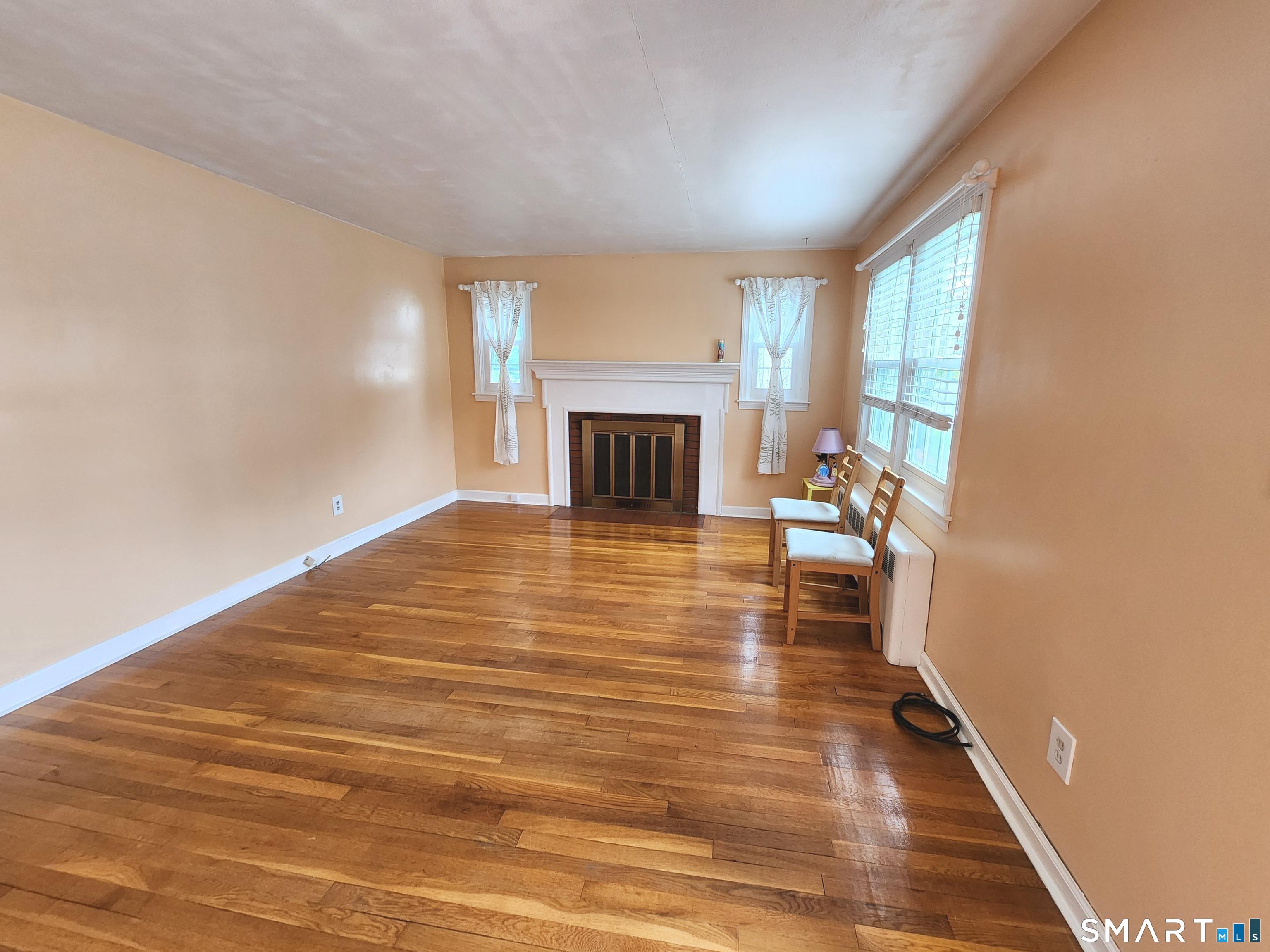 20 Victoria Road Manchester, CT 06040 - Photo 4 of 27 Formal Living room with beautiful hardwood floors
