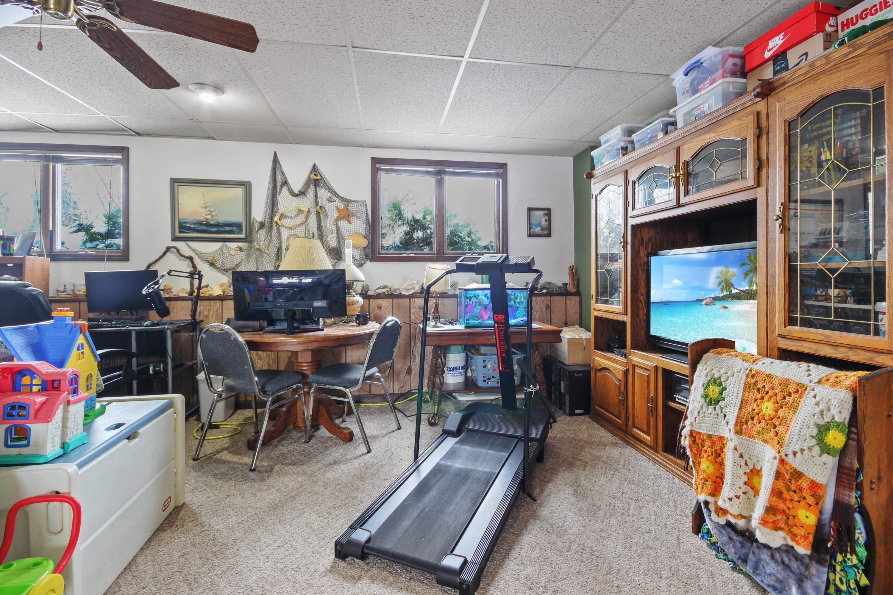 9272 Vigo Street Crown Point, IN 46307 - Photo 11 of 21 a living room with furniture a flat screen tv and a large window