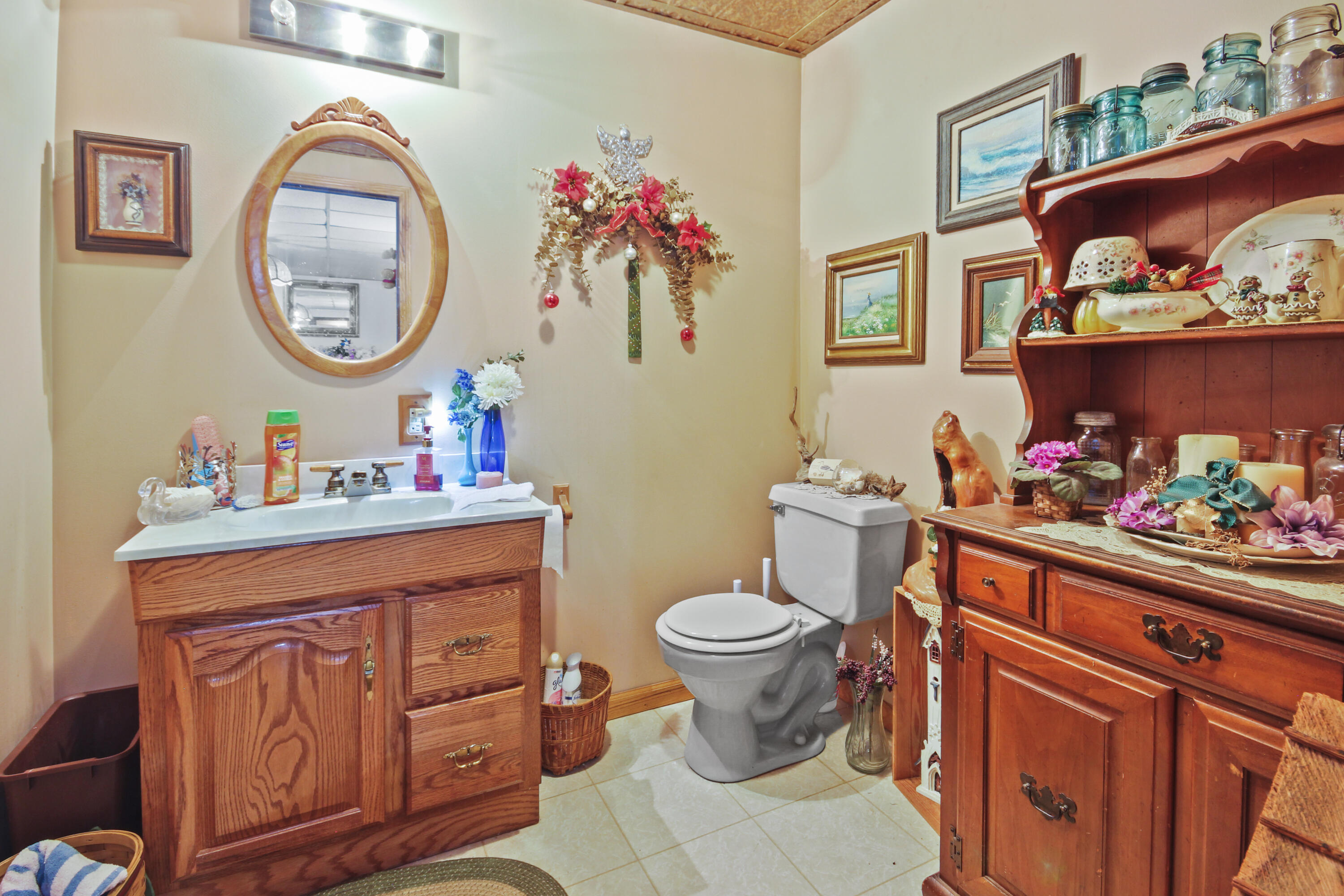 9272 Vigo Street Crown Point, IN 46307 - Photo 14 of 21 a bathroom with a toilet a sink and a mirror