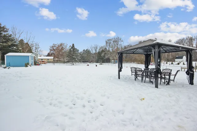 a view of a terrace with chairs and a table