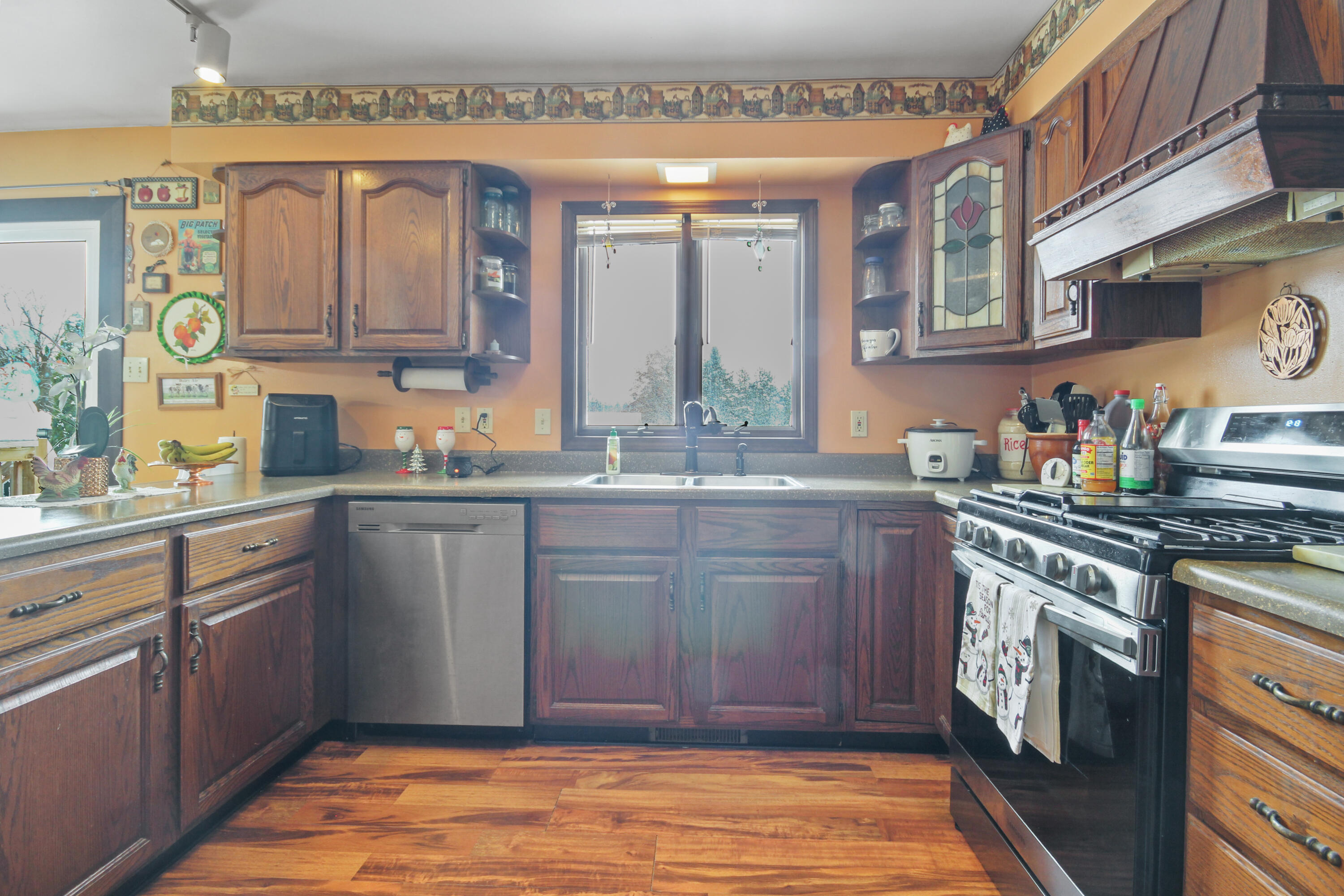 9272 Vigo Street Crown Point, IN 46307 - Photo 2 of 21 a kitchen with stainless steel appliances granite countertop a sink stove and cabinets