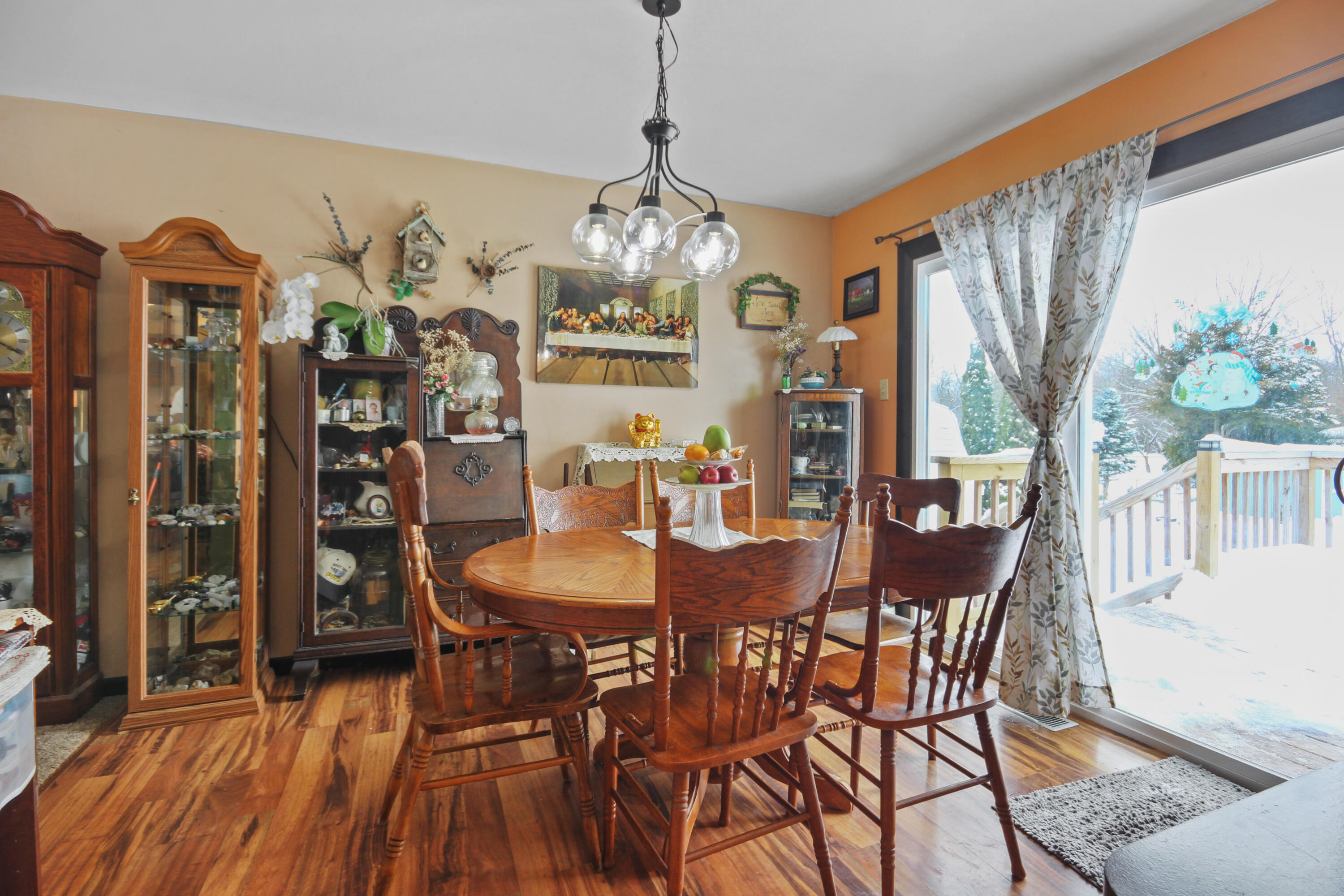 9272 Vigo Street Crown Point, IN 46307 - Photo 4 of 21 a view of a dining room with furniture window and wooden floor
