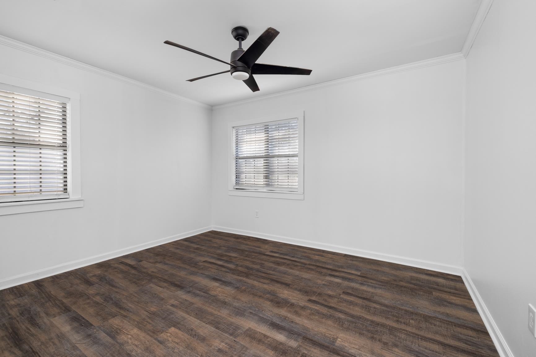 8424 Old Memphis Road Brighton, TN 38011 - Photo 5 of 29 a view of empty room with wooden floor and fan