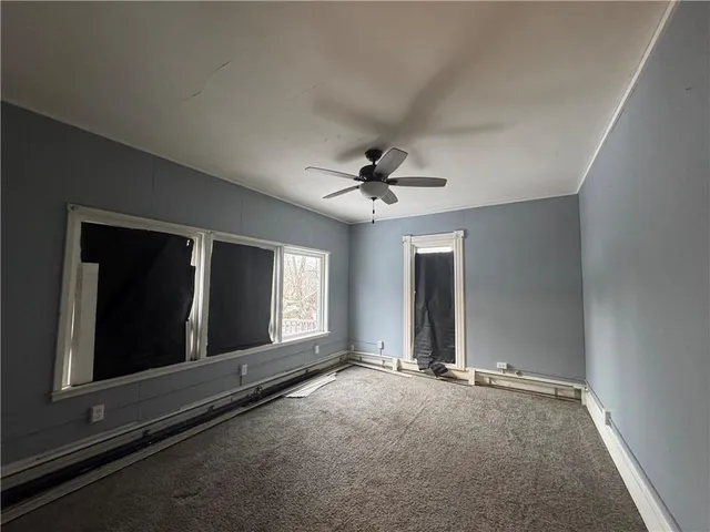 wooden floor and window in an empty room