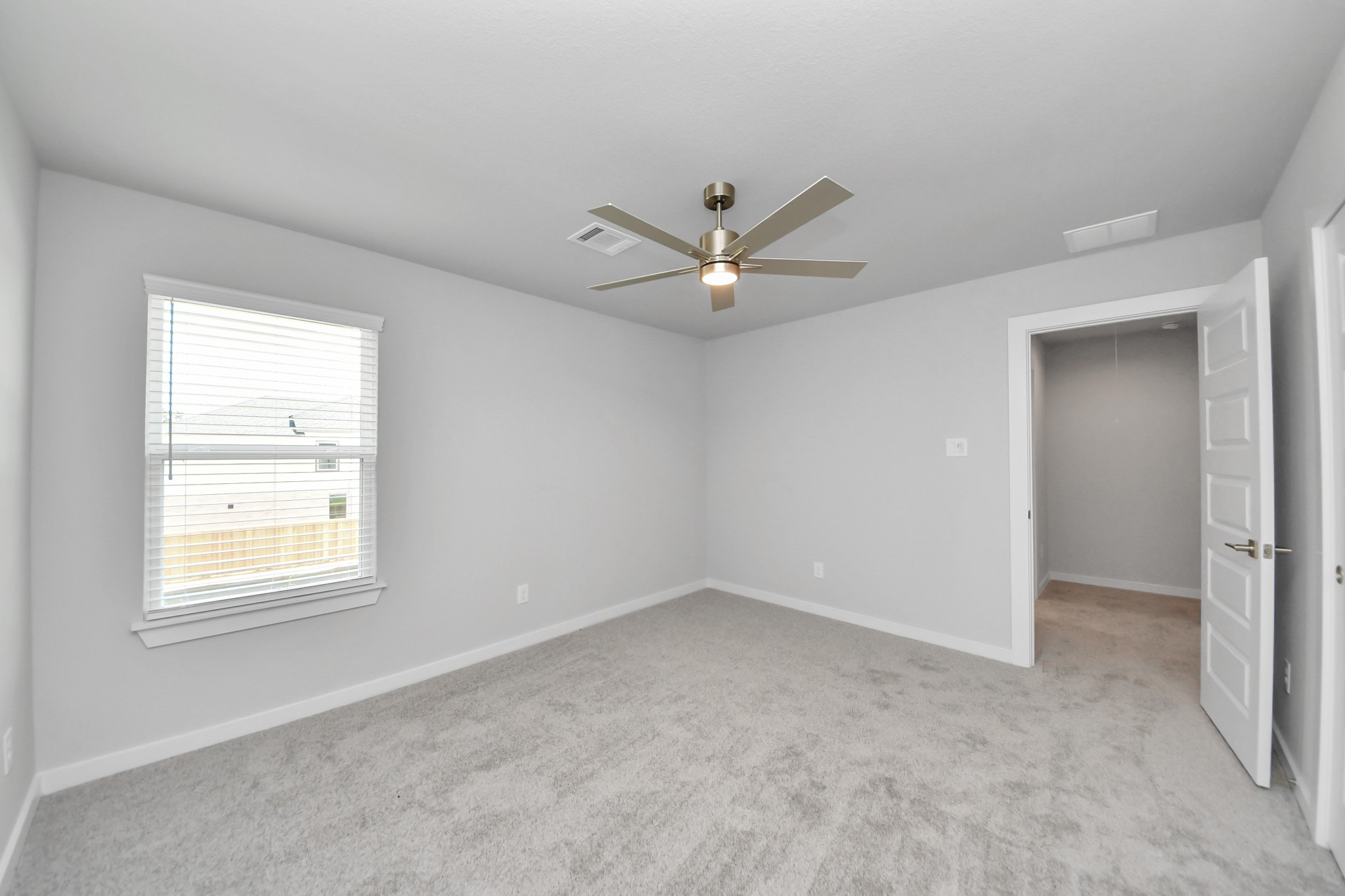 3043 Native Spg Drive Spring, TX 77373 - Photo 32 of 45 Generously sized secondary bedrooms featuring spacious closets, soft and inviting carpeting underfoot, large windows allowing plenty of natural light, and the added touch of privacy blinds for your personal retreat.