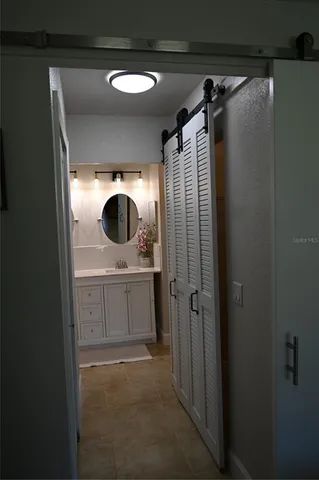 a kitchen with stainless steel appliances a stove microwave and refrigerator