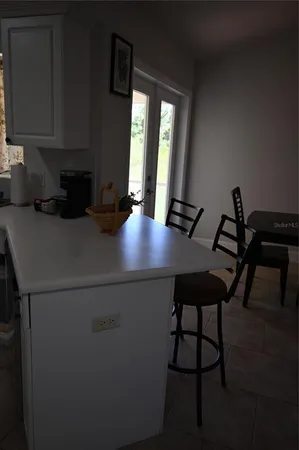 a view of a hallway with a room