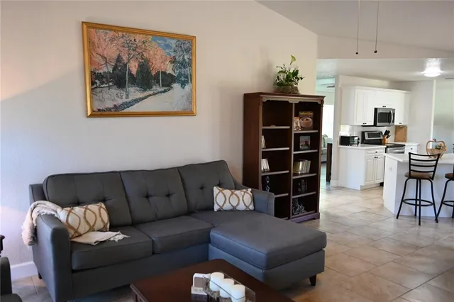 a bedroom with a bed and a lamp