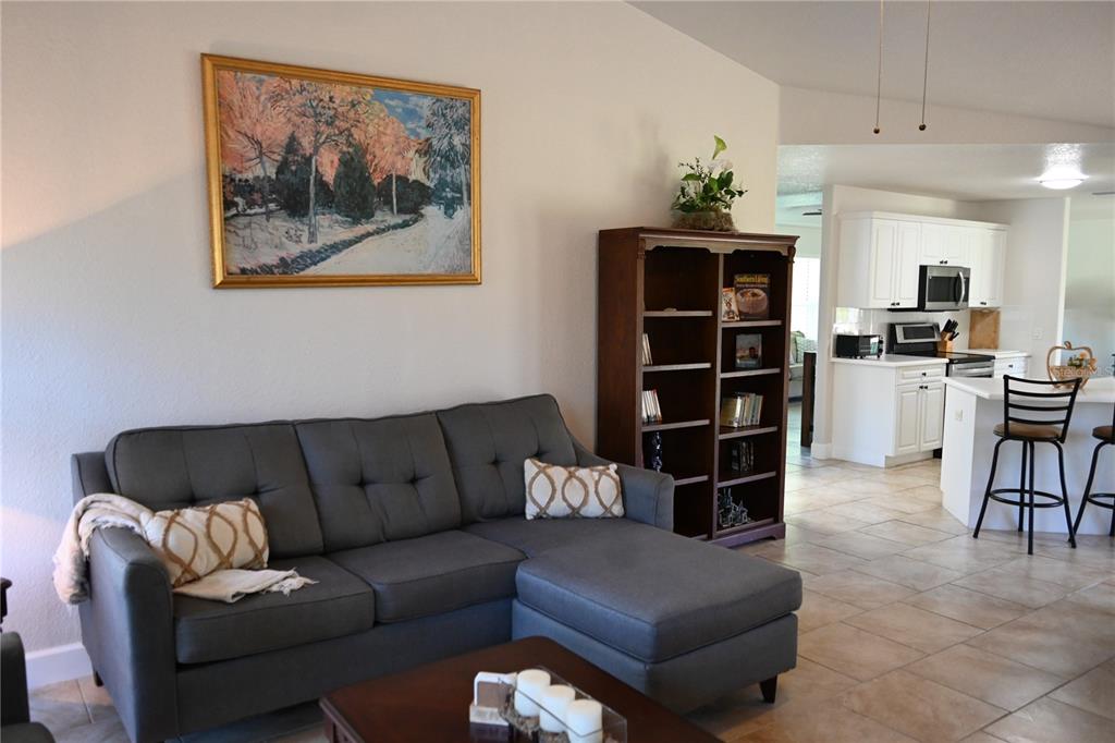 5378 Dunsmuir Road North Port, FL 34288 - Photo 32 of 59 a living room with furniture and a flat screen tv