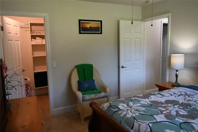 a bathroom with a granite countertop sink a mirror and vanity