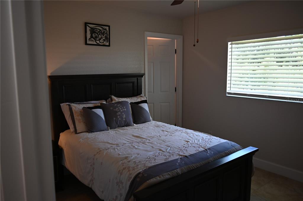 5378 Dunsmuir Road North Port, FL 34288 - Photo 44 of 59 a bedroom with a bed and a window