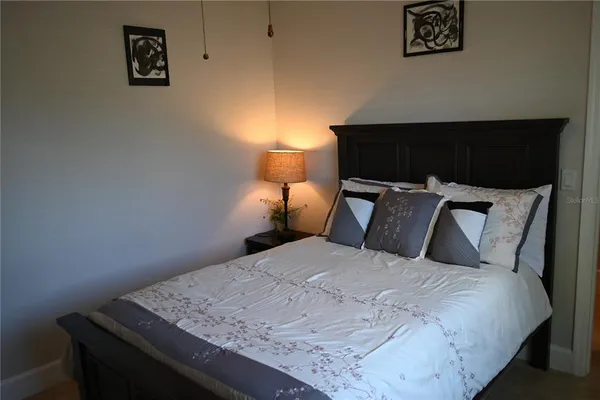 a living room with furniture and a ceiling fan