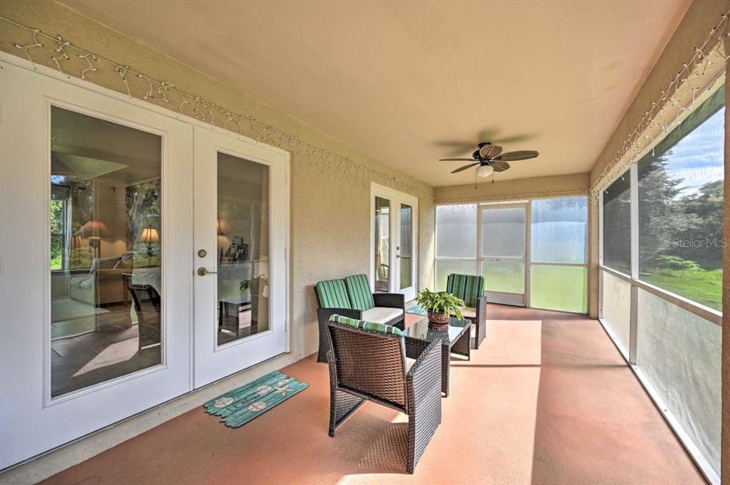 5378 Dunsmuir Road North Port, FL 34288 - Photo 52 of 59 a living room with furniture and a large window