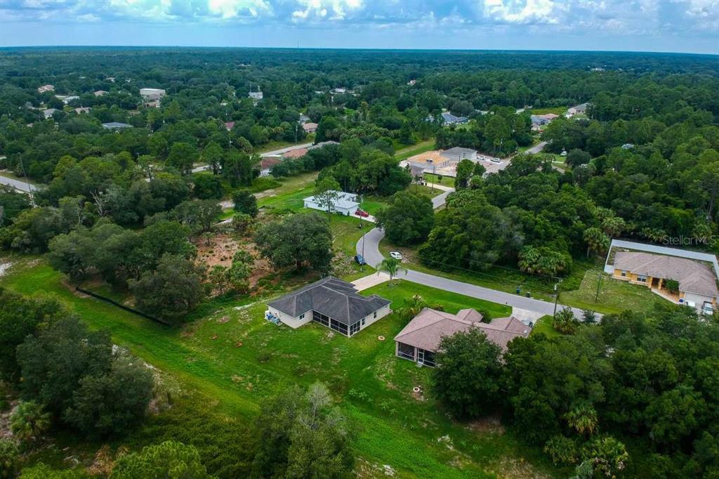 5378 Dunsmuir Road North Port, FL 34288 - Photo 56 of 59 an aerial view of residential houses with outdoor space and trees