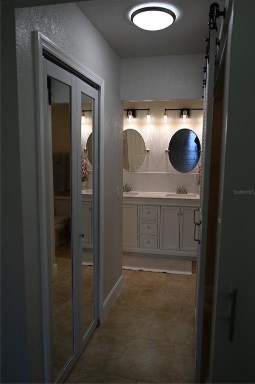5378 Dunsmuir Road North Port, FL 34288 - Photo 10 of 59 a bathroom with a sink and a mirror