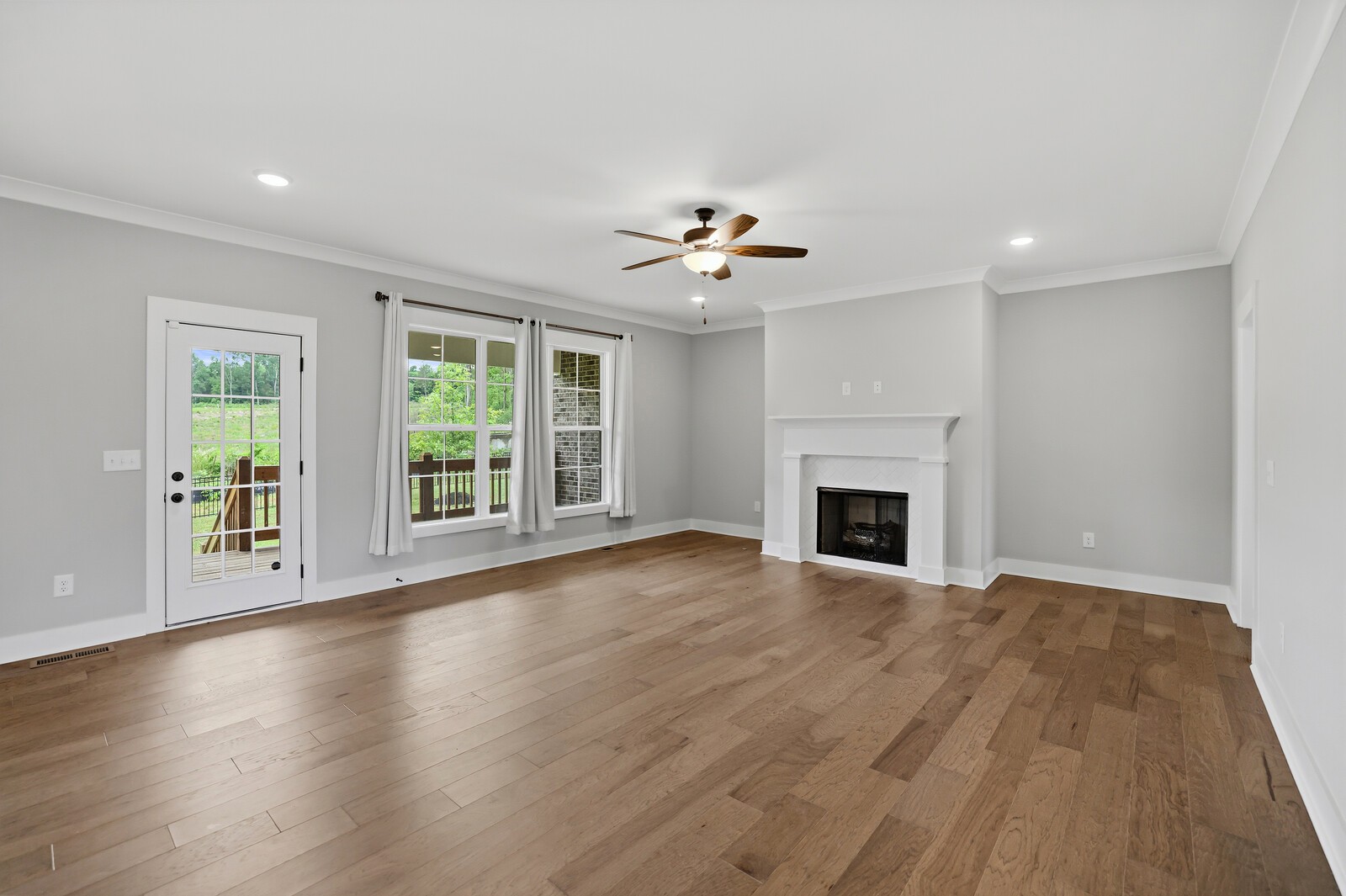 400 Millstone Place Lebanon, TN 37087 - Photo 12 of 58 a view of an empty room with a fireplace and a window