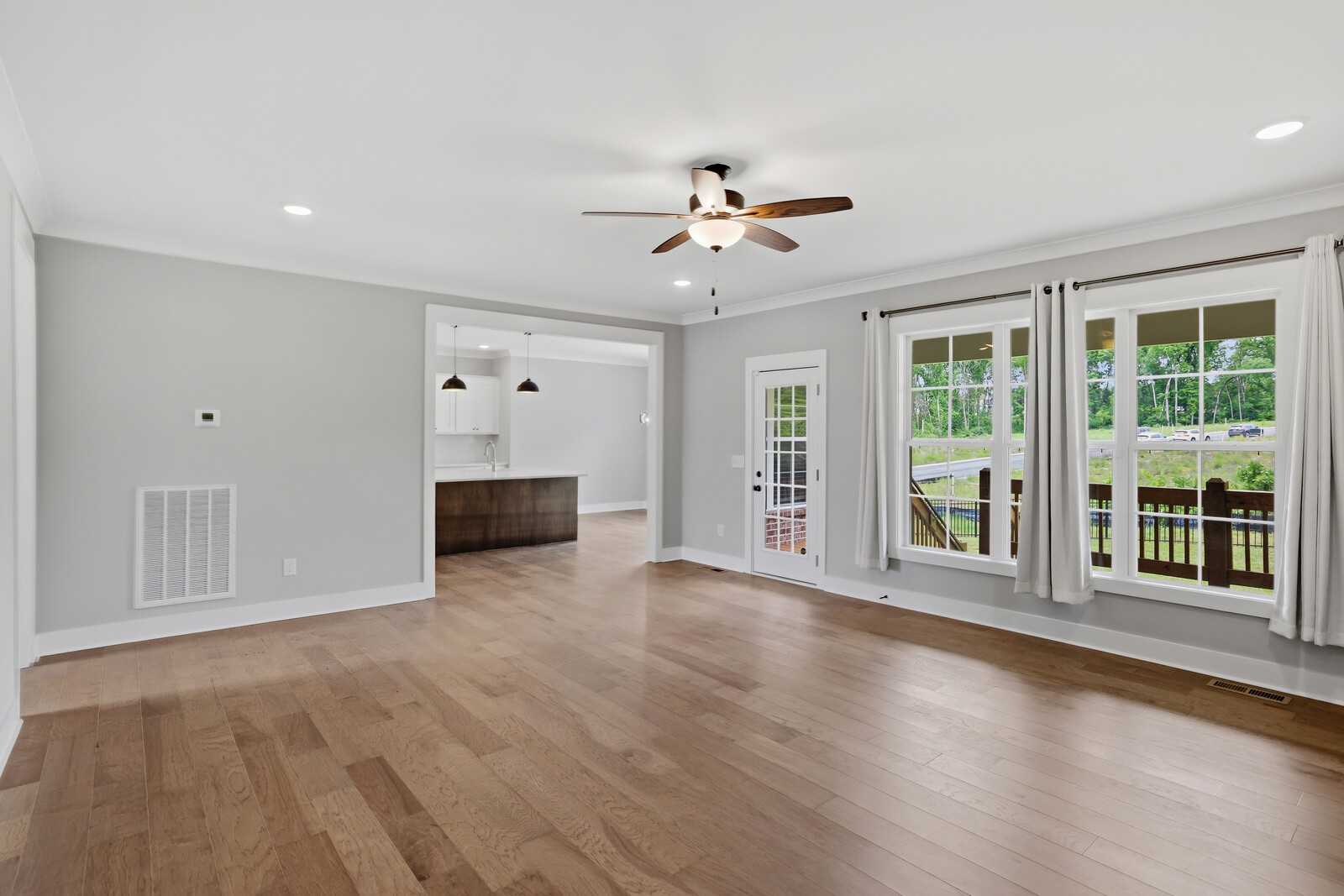 400 Millstone Place Lebanon, TN 37087 - Photo 14 of 58 a view of a livingroom with wooden floor and a ceiling fan
