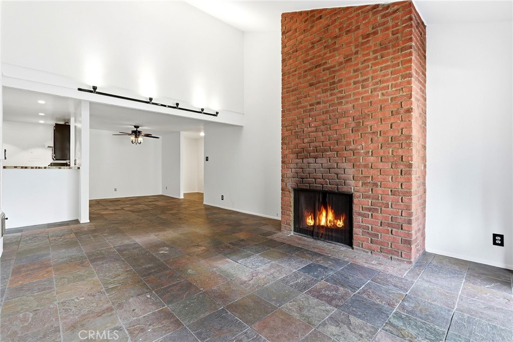 7890 East Spring Street, Unit 11E Long Beach, CA 90815 - Photo 13 of 40 a view of a livingroom with a fireplace