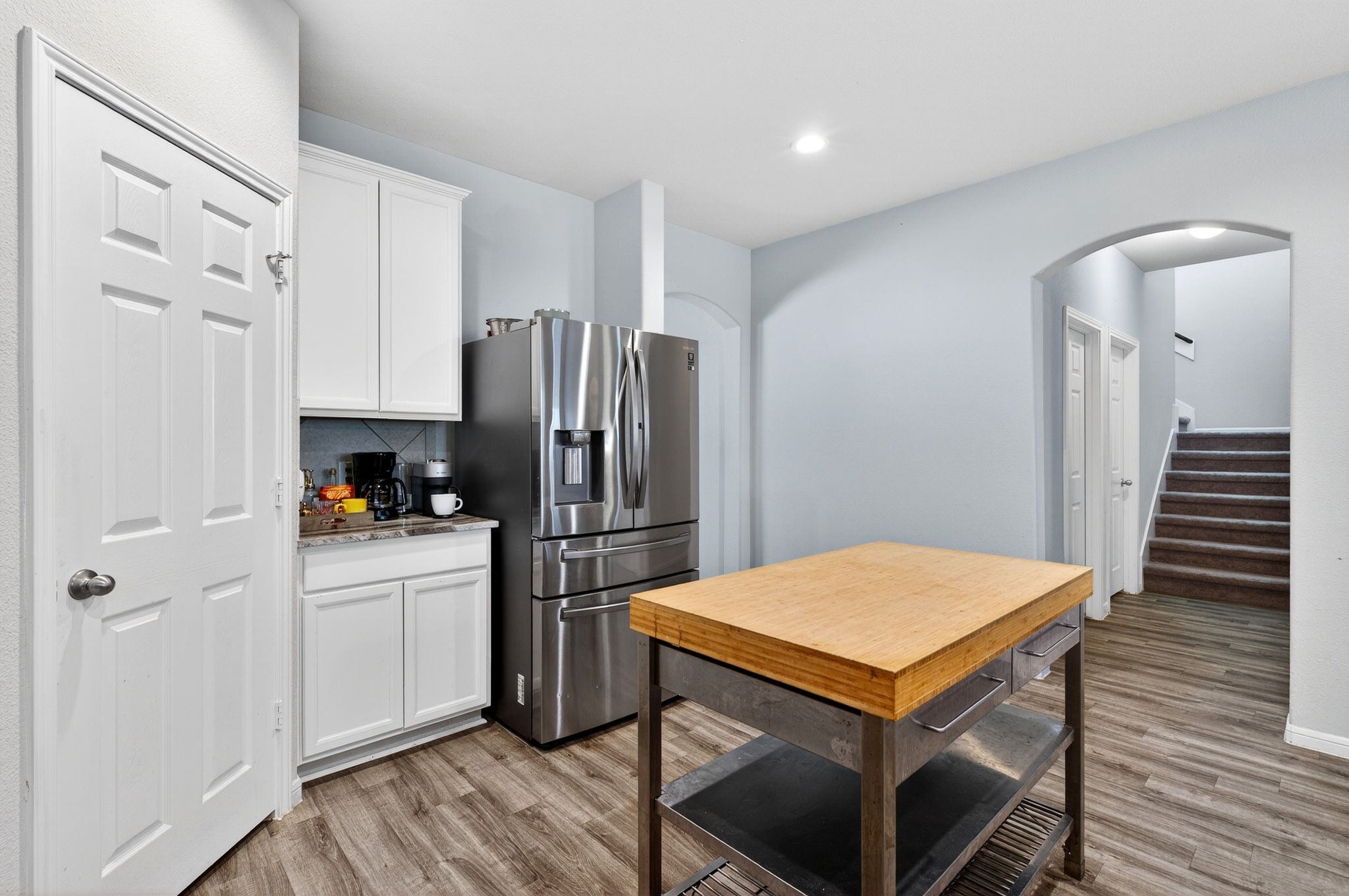 2121 Cedar Way Drive Conroe, TX 77301 - Photo 6 of 27 a kitchen with stainless steel appliances a refrigerator and a stove top oven