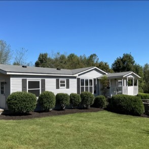 a front view of a house with a yard
