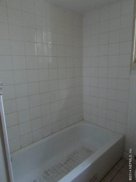 3018 Kline Road Jacksonville, FL 32246 - Photo 12 of 23 a close up of a bathtub